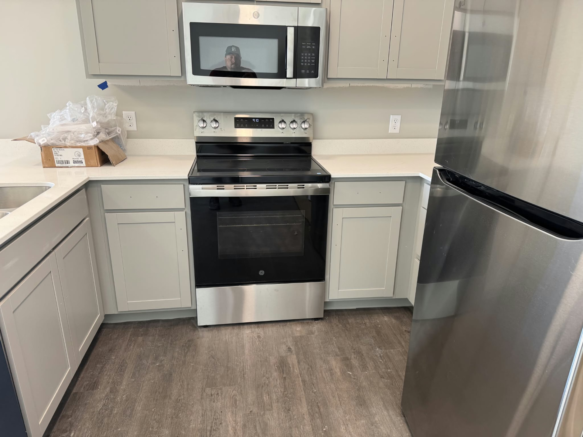 The same kitchen after cleaning, with spotless surfaces and floor