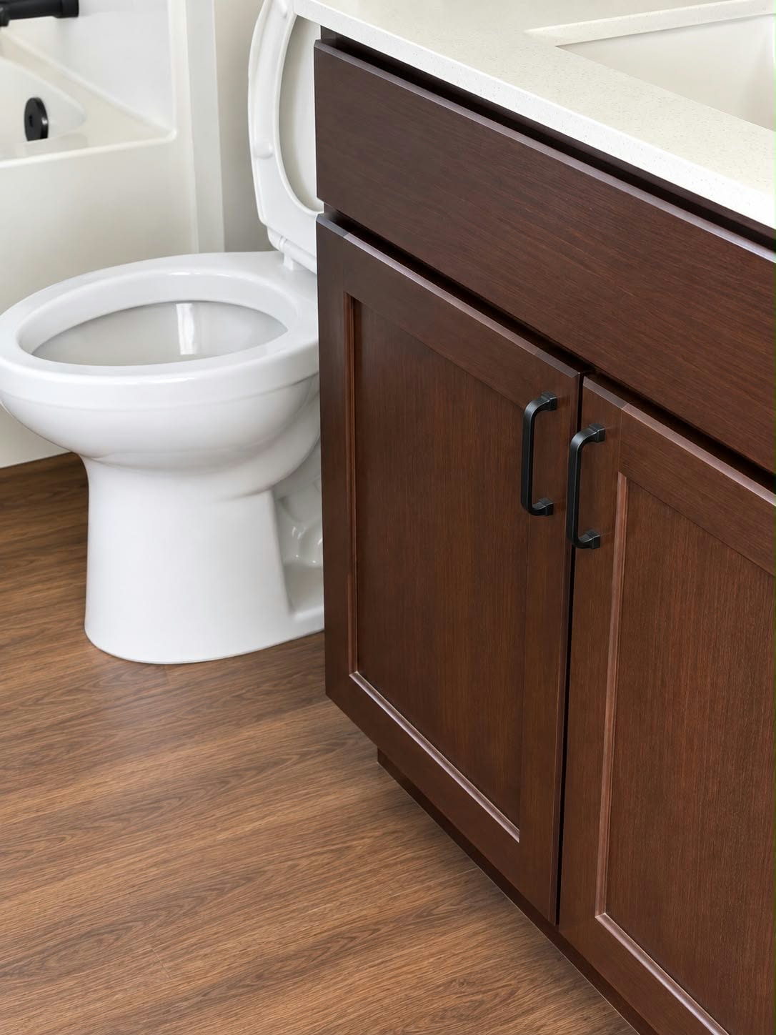 A spotless bathroom vanity and toilet after cleaning
