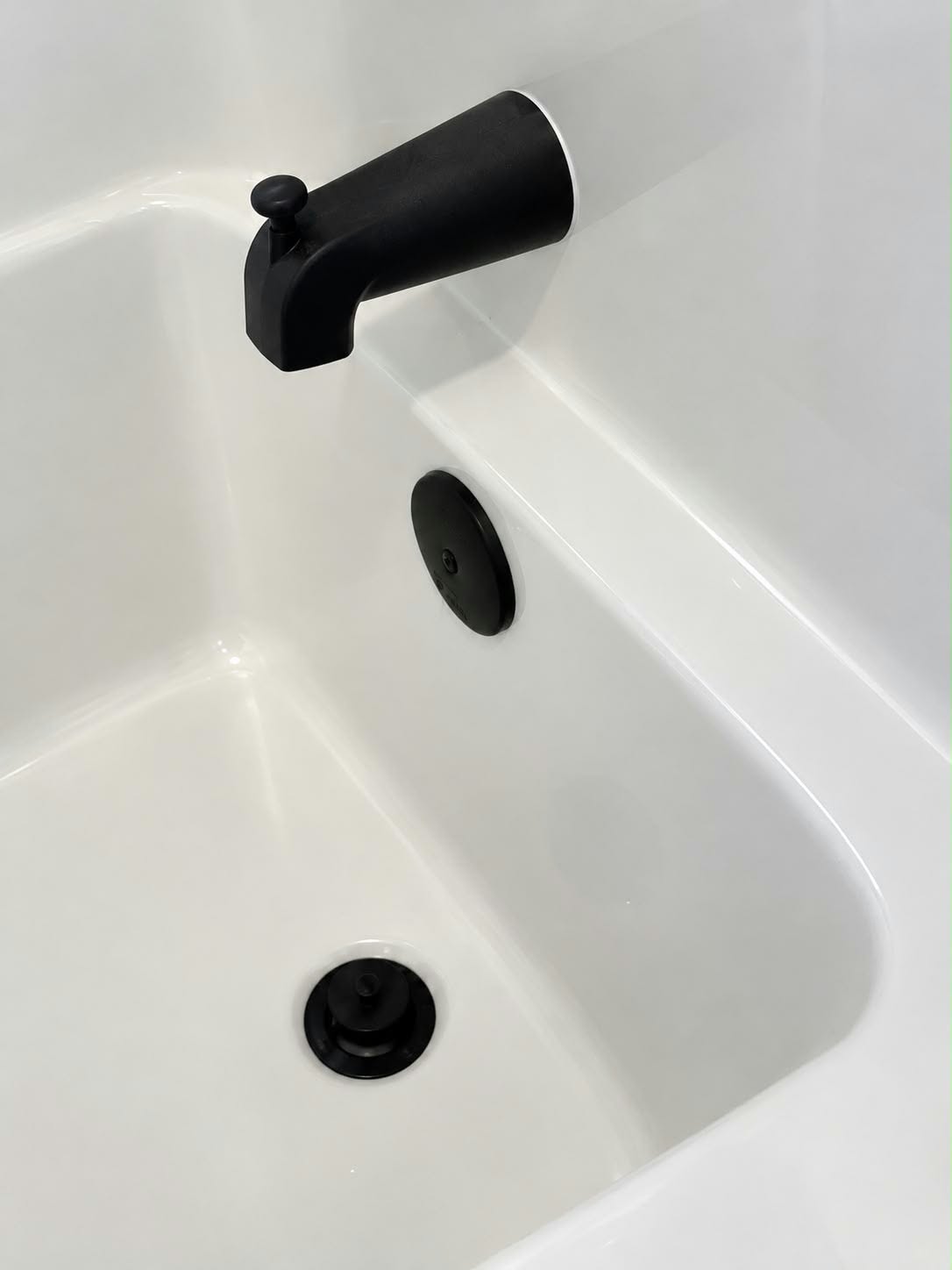 A gleaming white bathtub after a deep clean